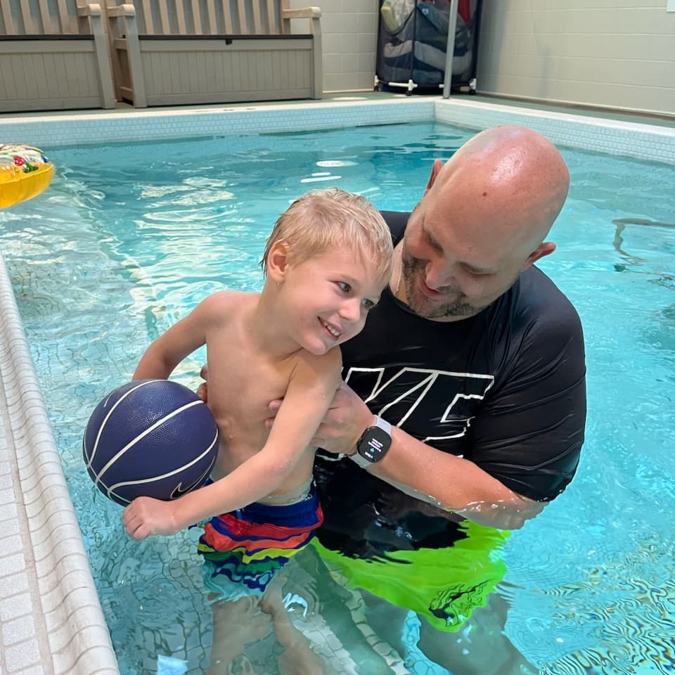 Child and Man in Pool
