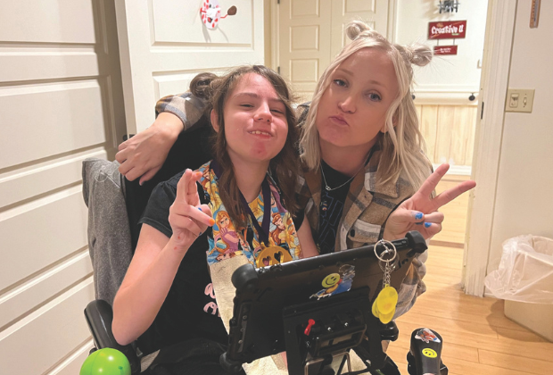 Two girls with peace signs