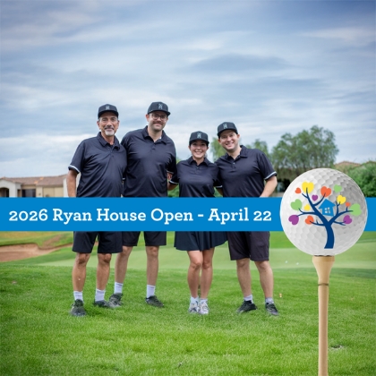 Four people in navy outfits